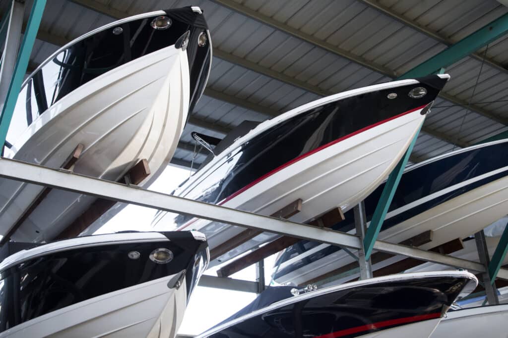 Rack,Of,Modern,Speedboats,For,Sale,,With,Pointed,Fiberglass,Hulls